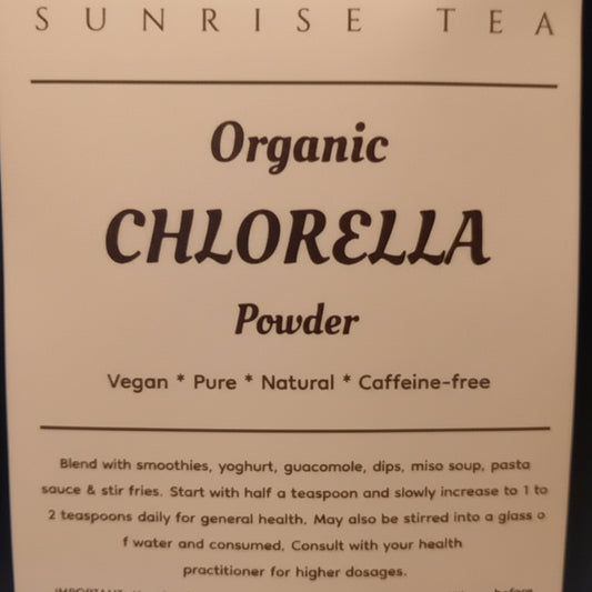 Bag of Organic Chlorella Powder by Sunrise Tea on a black background