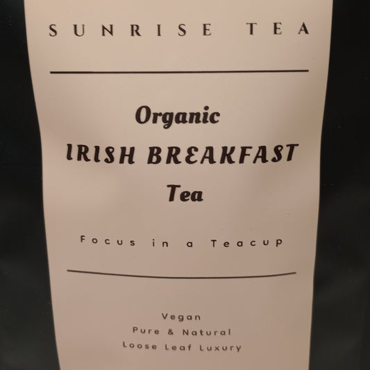 Tea package with 'Sunrise Tea' label on a plain background