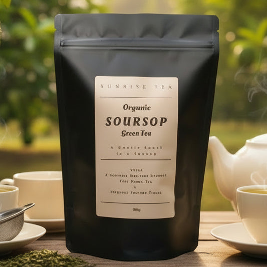 Black tea package labeled 'Organic Soursop Green Tea' with a tea setting in the background.