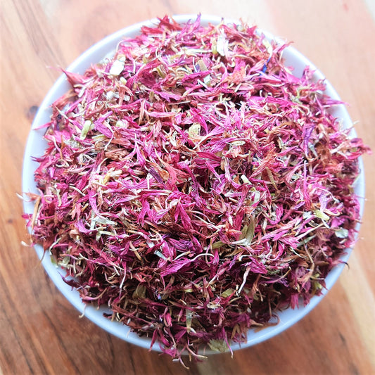 purple or pink cornflowers dried in white bowl