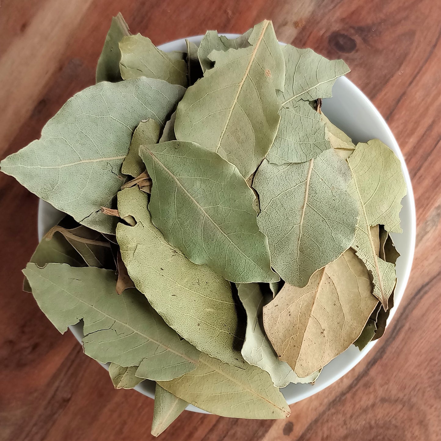 dried bay leaves in a small bowl