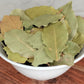 dried bay leaves in a small bowl