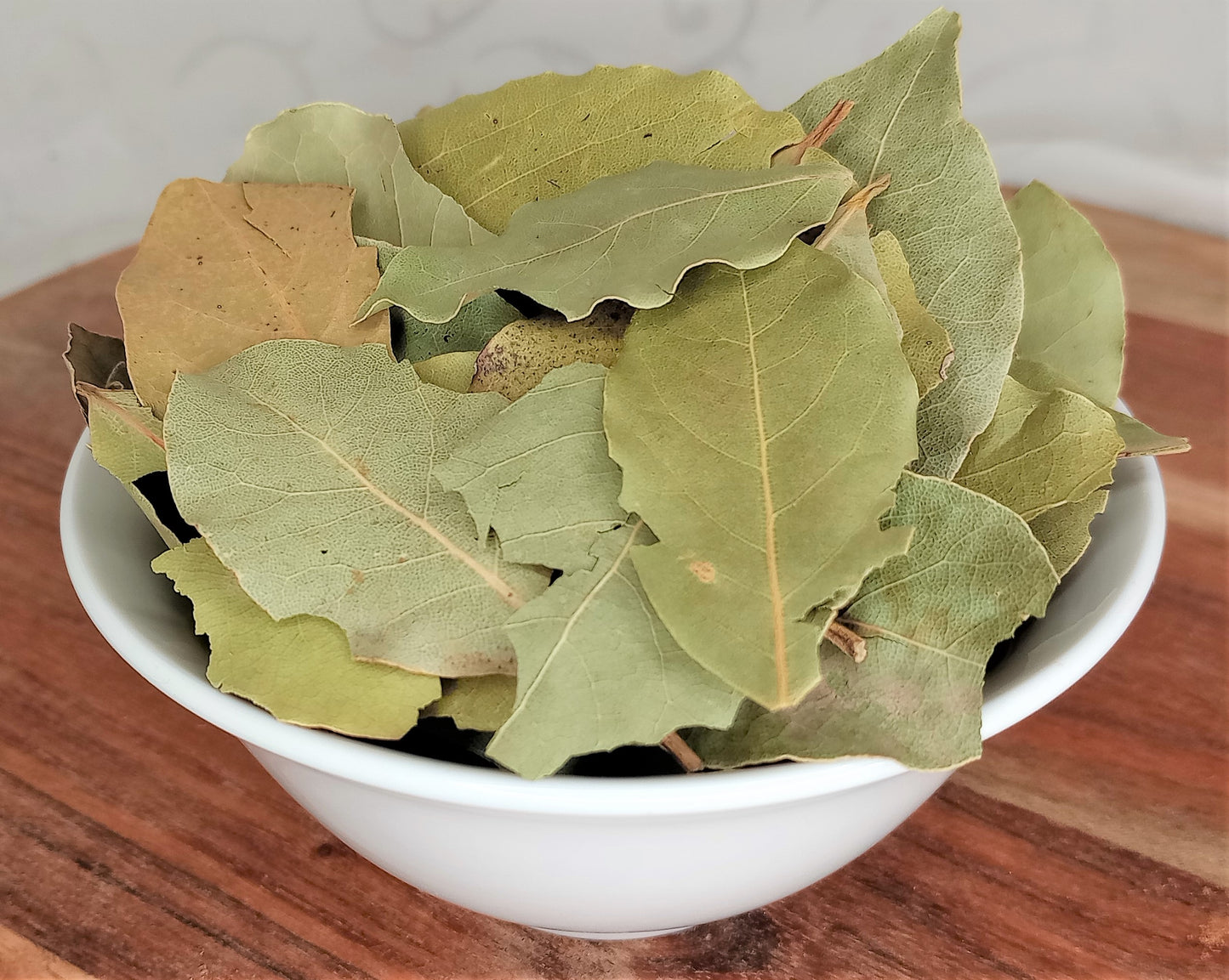 dried bay leaves in a small bowl