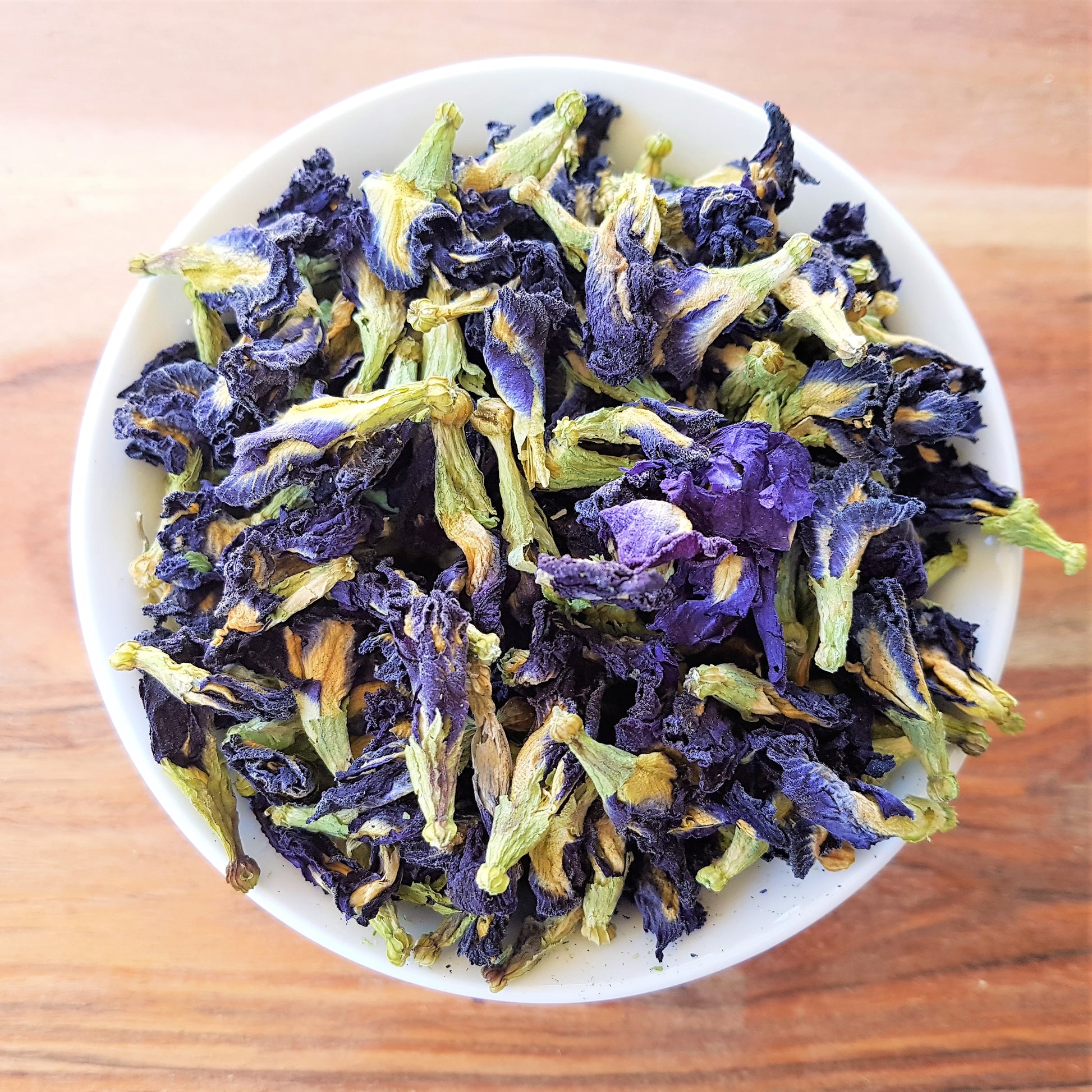 organic butterfly pea flowers in bowl