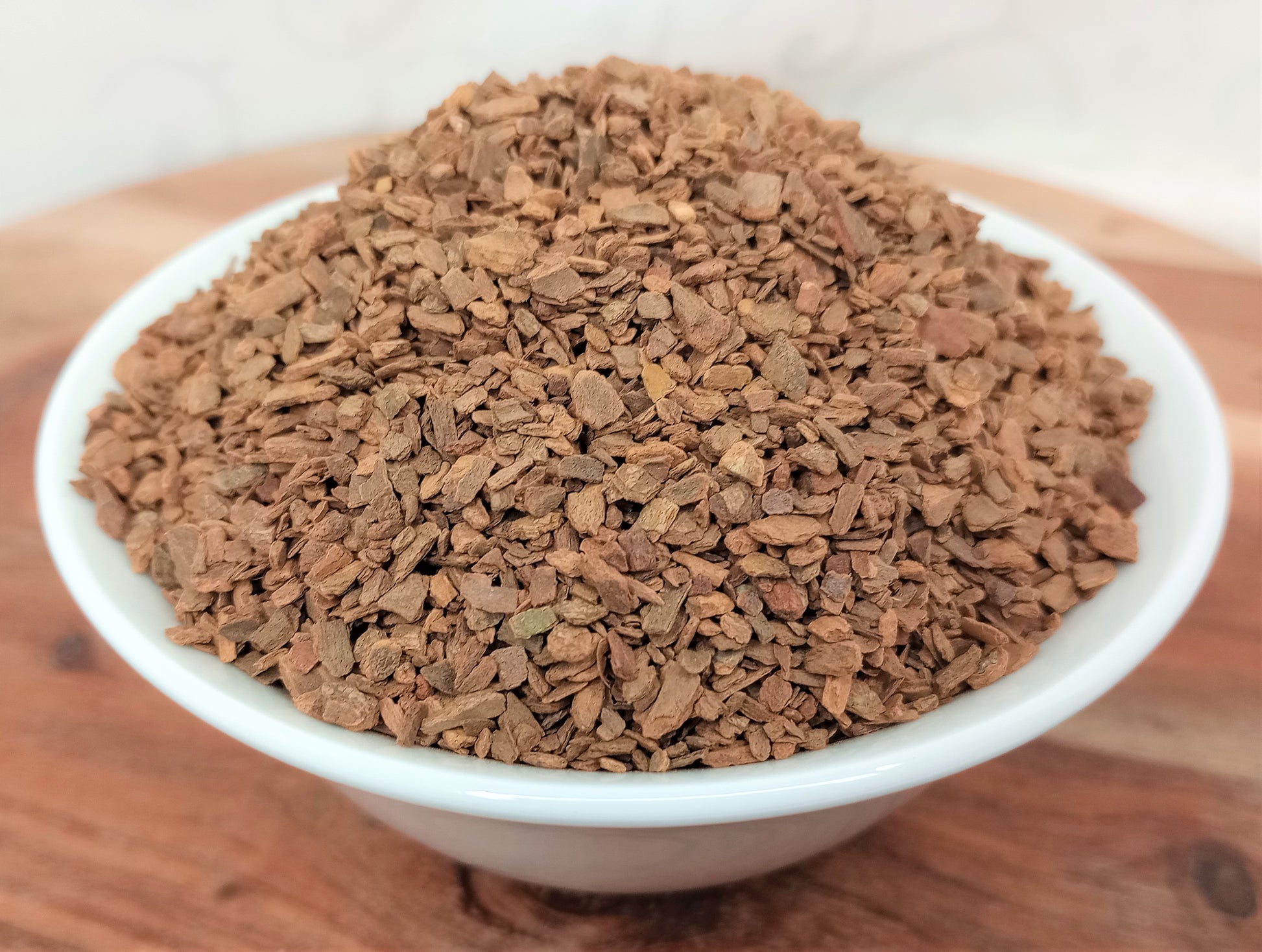 cinnamon bark chips in white bowl