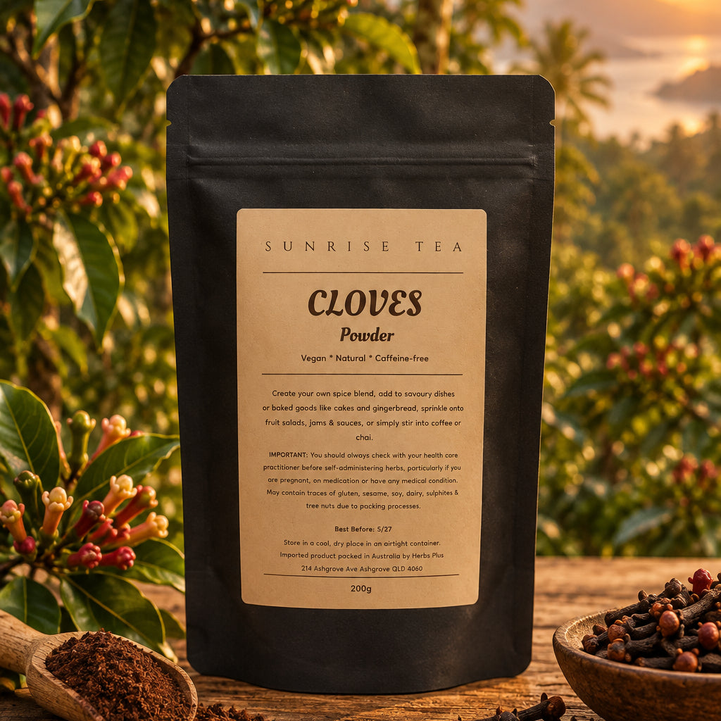A black stand-up pouch of Sunrise Tea Cloves Powder with a beige label, photographed on a white fabric surface.