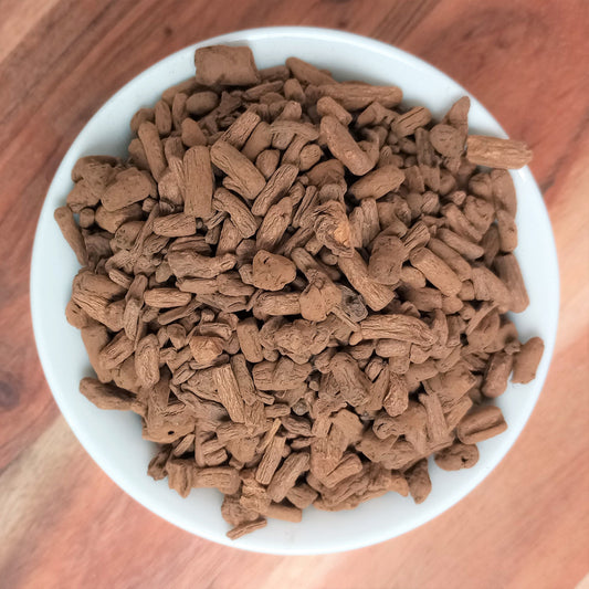 roasted dandelion root in white bowl