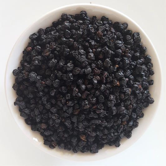 whole dried elderberries in a bowl