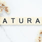 the word NATURAL spelt out using Scrabble letters