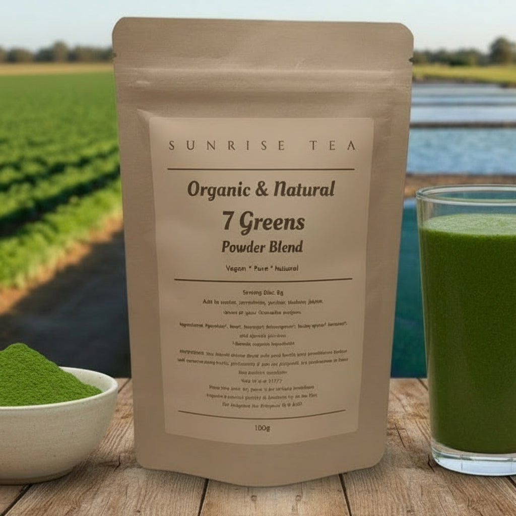 Sunrise Tea Organic & Natural 7 Greens Powder Blend package with a glass of green juice and bowl of powder on a wooden surface with a scenic background.