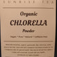 Bag of Organic Chlorella Powder by Sunrise Tea on a black background