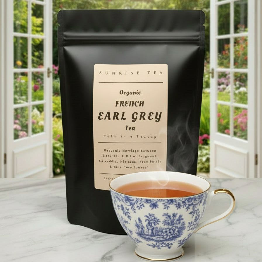 Black tea package labeled 'French Earl Grey' with a teacup and teapot on a blurred green background
