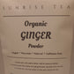 Package of Sunrise Tea Organic Ginger Powder on a brown background