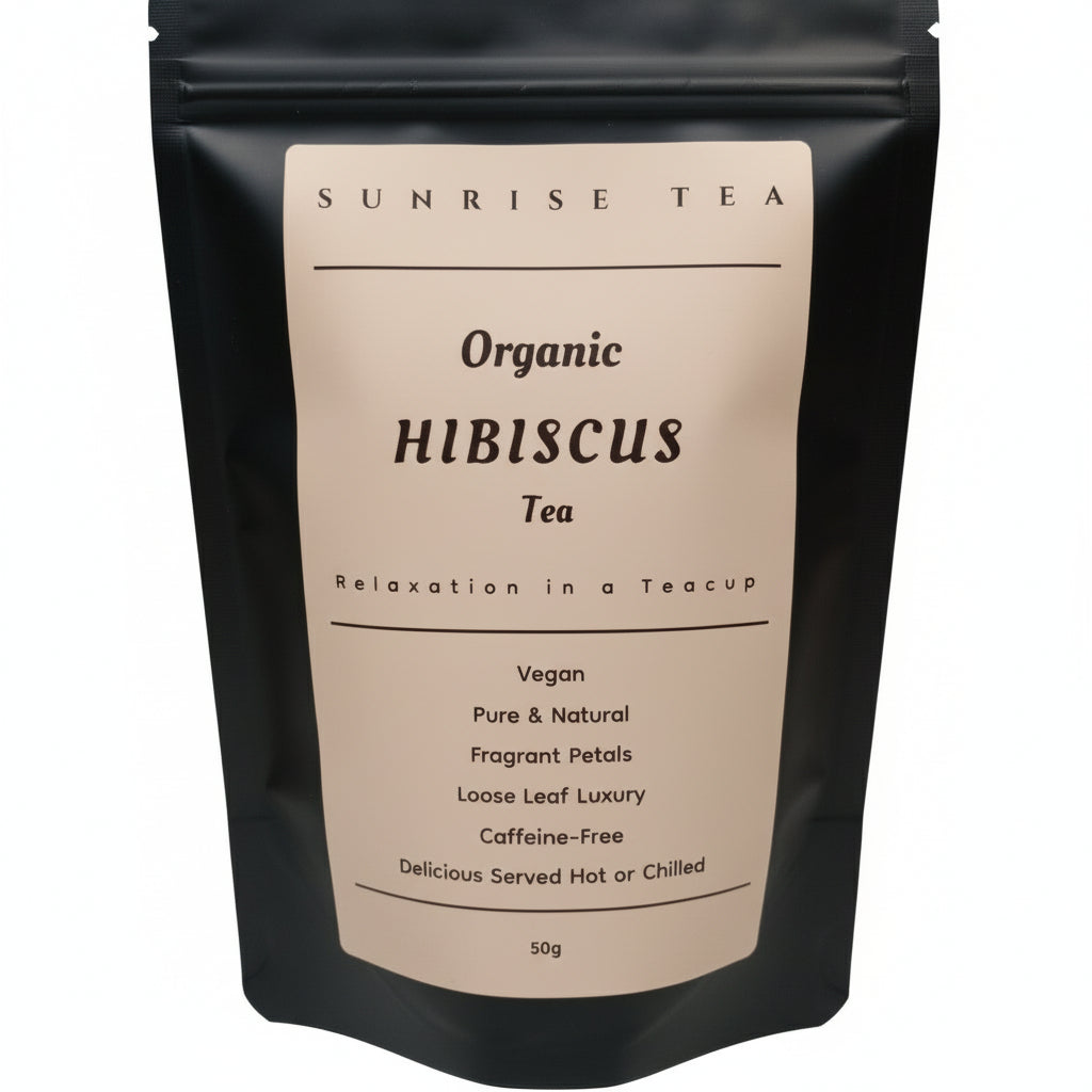 Black tea bag with 'Sunrise Tea' label on a white background