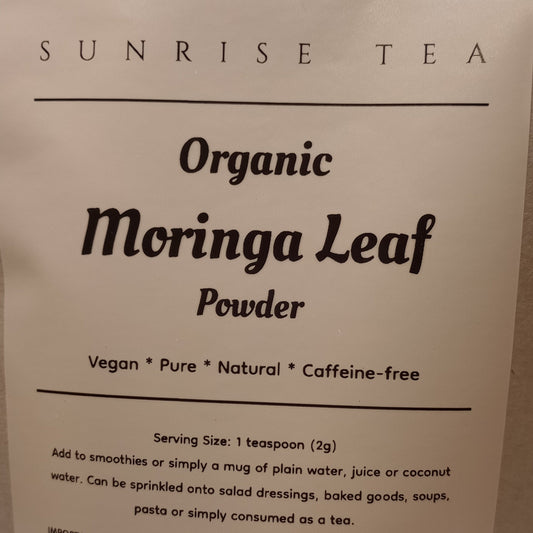 Bag of Organic Moringa Leaf Powder with 'Sunrise Tea' branding on a white background