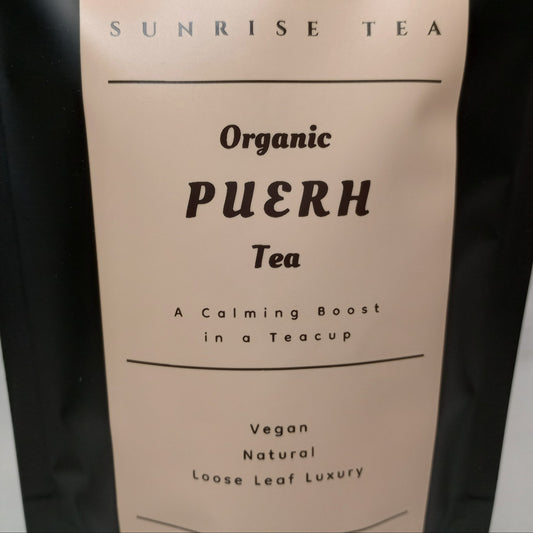 Bag of Organic Puerh Tea with 'Sunrise Tea' branding on a plain background