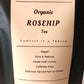 Label for Organic Rosehip Tea with text about the product on a beige background.