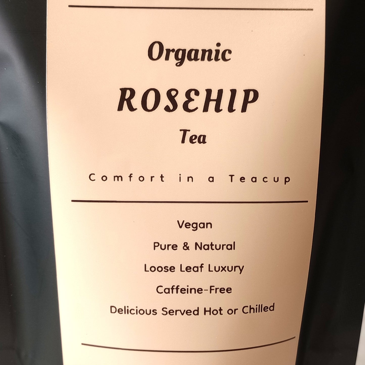 Label for Organic Rosehip Tea with text about the product on a beige background.