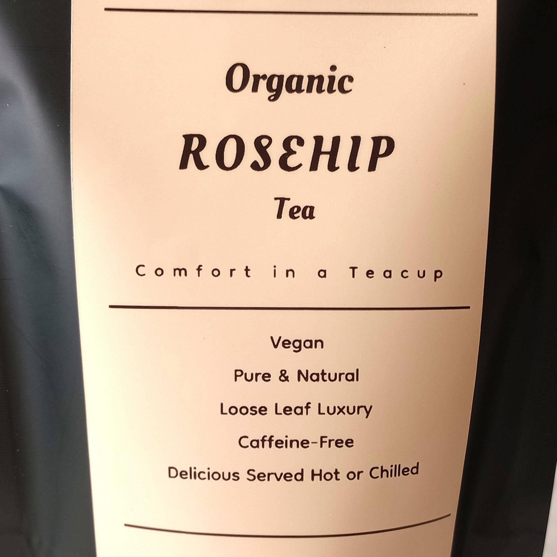 Label for Organic Rosehip Tea with text about the product on a beige background.
