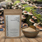 Kraft paper packaging of Organic Turkey Tail Mushroom Powder with a white label on a light gray background.