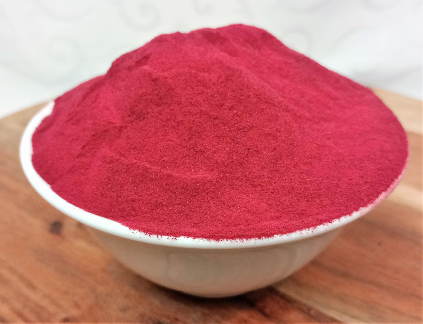 organic beetroot powder in a bowl in a deep red colour