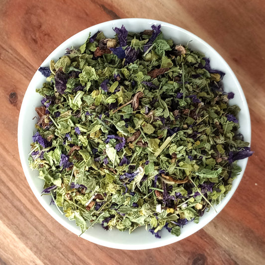 organic dried blue mallow herb in a white bowl