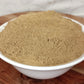 organic brahmi powder in bowl on board