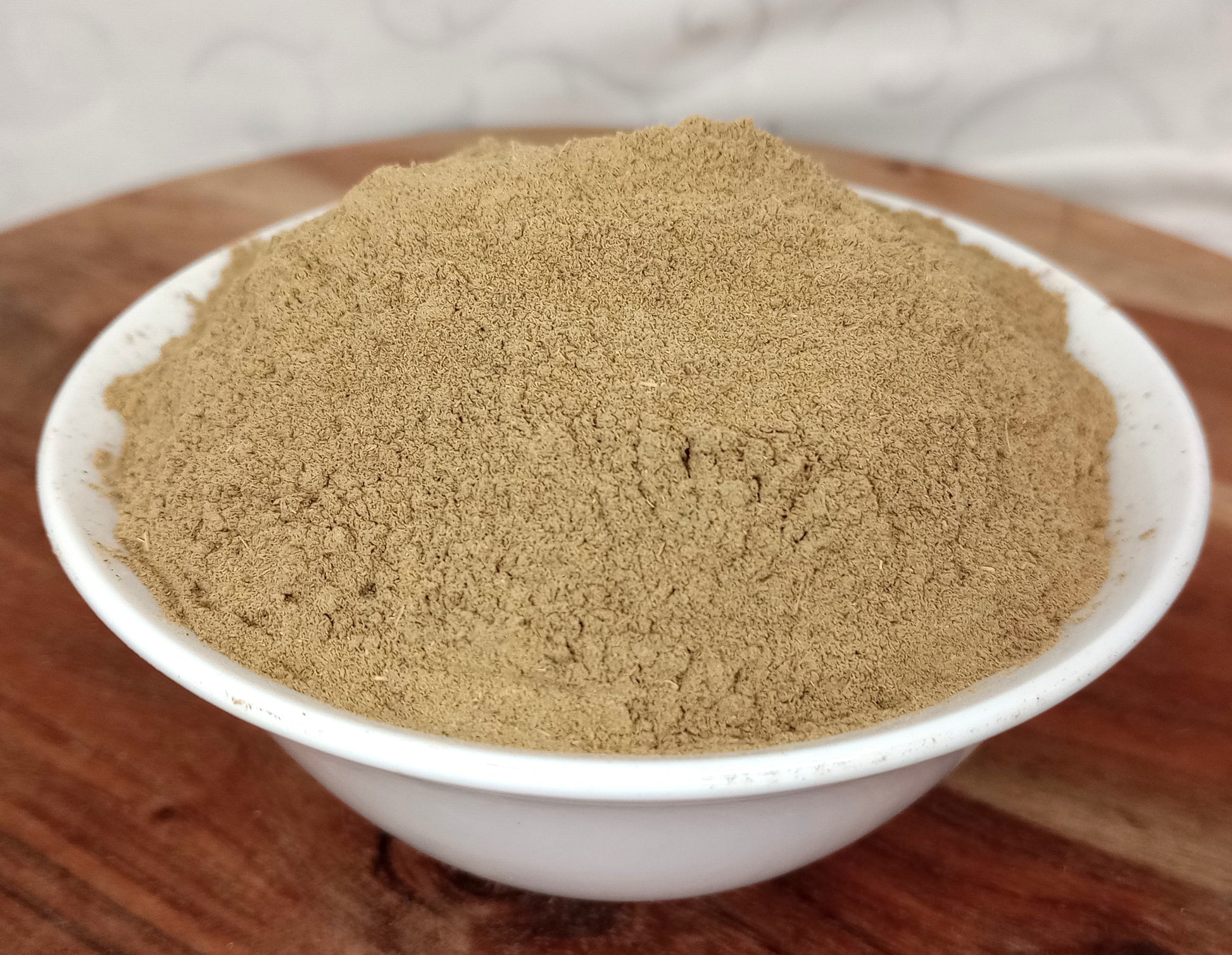 organic brahmi powder in bowl on board