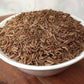 organic caraway seeds in a bowl close up