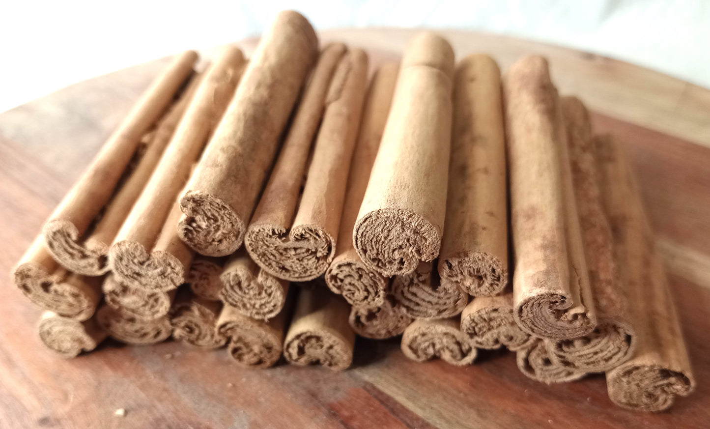 organic ceylon cinnamon quills on a wooden board