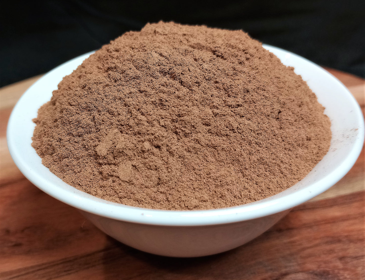 organic true or Ceylon cinnamon powder in bowl close up