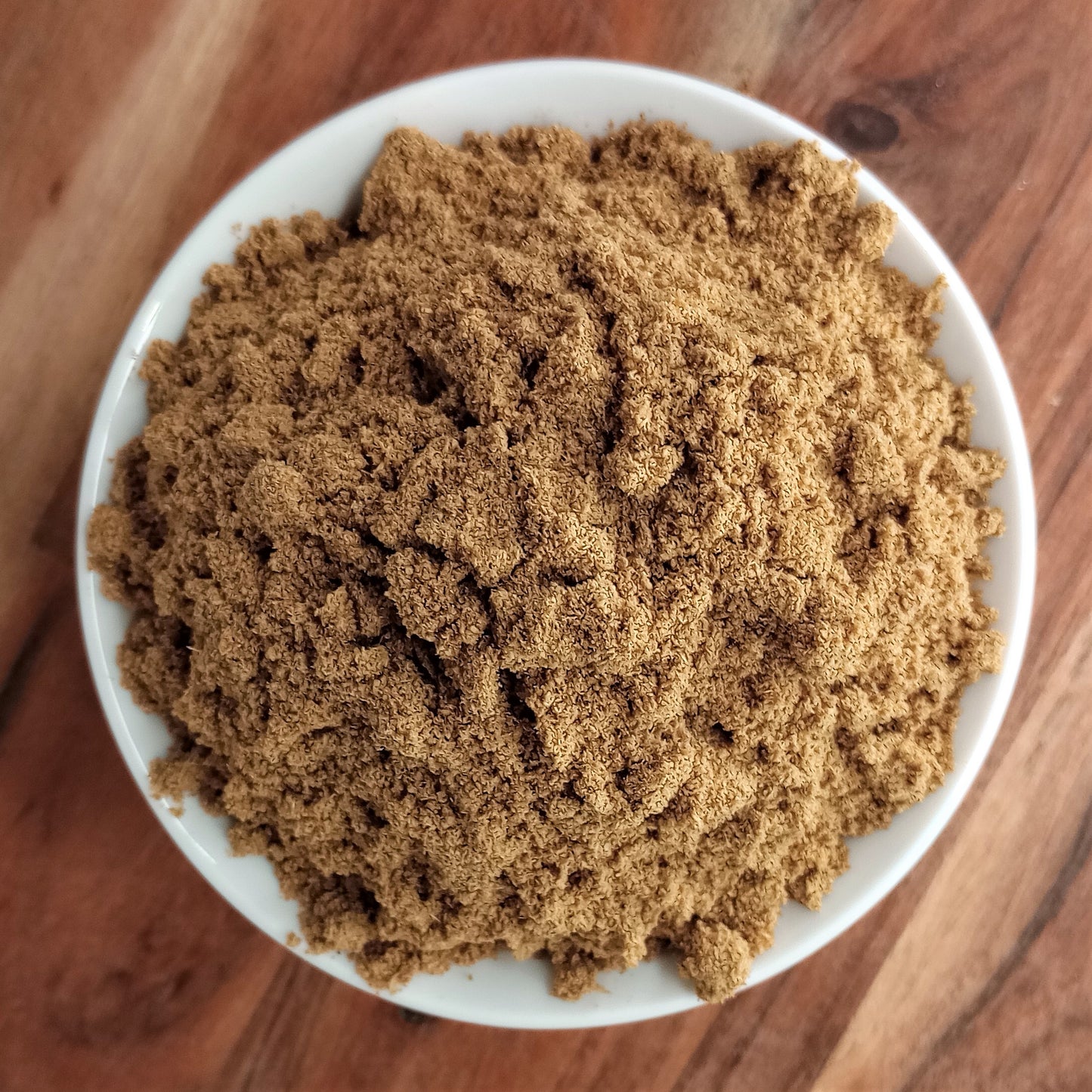 organic coriander powder in bowl