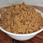 organic coriander powder in bowl close up