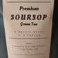 Label for Premium Soursop Green Tea on a dark background