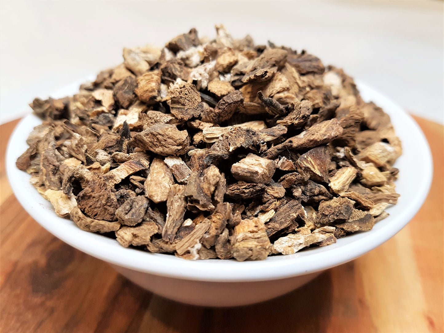 organic burdock root in bowl close up