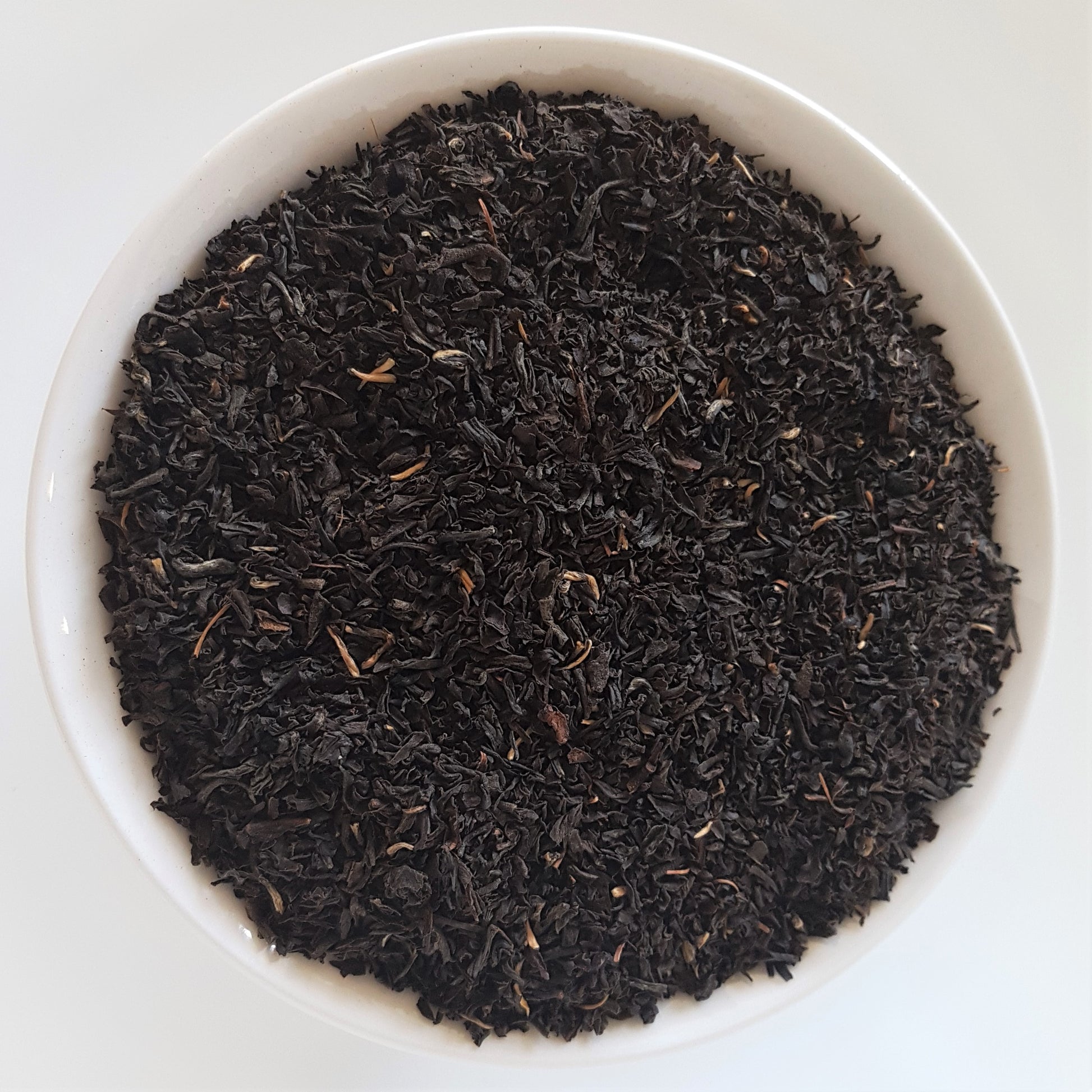 organic assam black tea in a white bowl