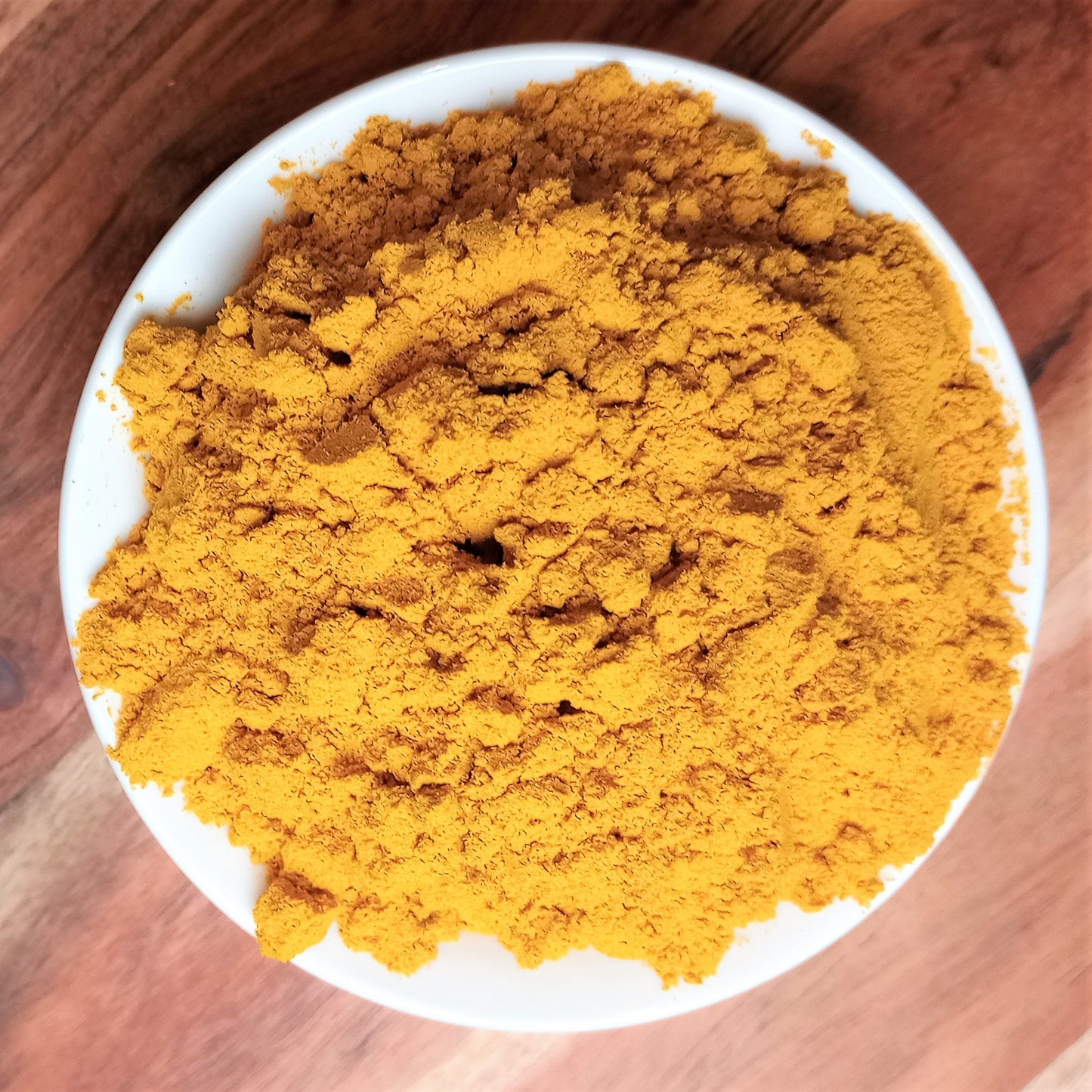 organic turmeric powder in bowl